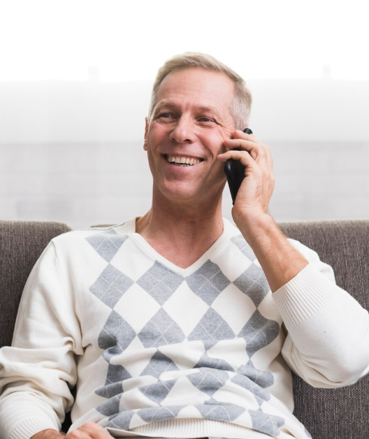 Man happily using Jeanie phone assistant